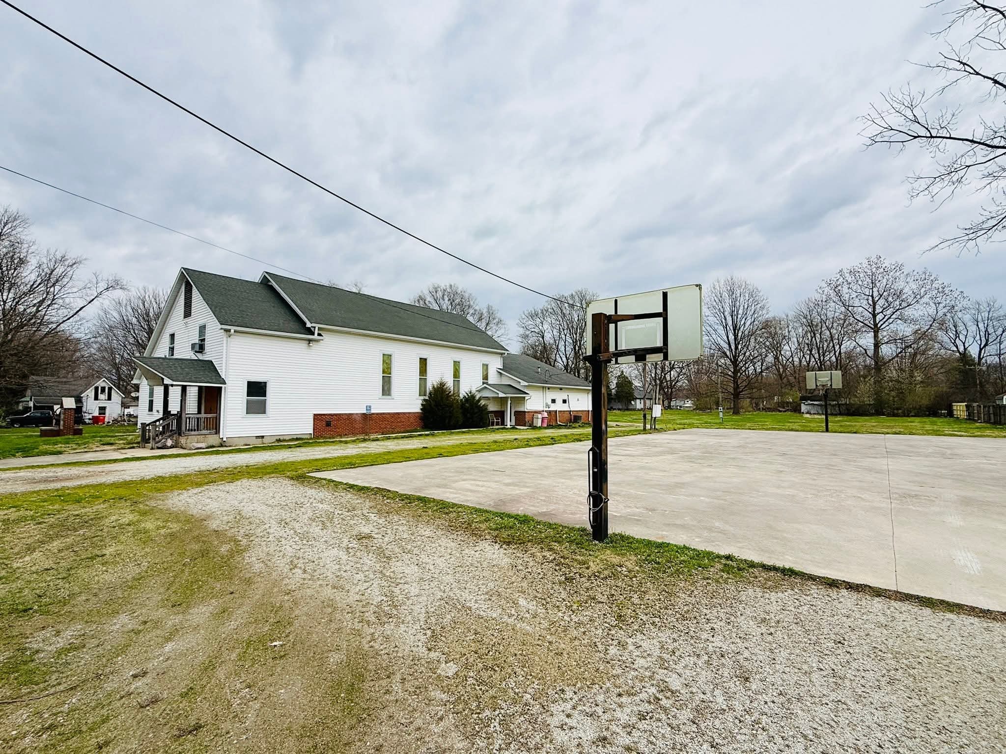 Side view of the Rustic Bell building and basketball court